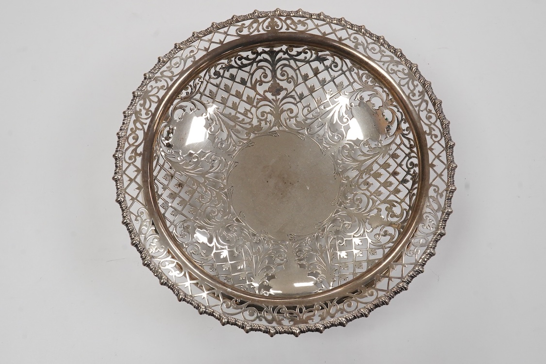 A George V pierced silver bowl, with gadrooned border, on three paw feet, James Dixon & Sons, Sheffield, 1931, diameter 20.8cm, 15oz.